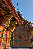 Wat Xieng Thong temple in Luang Prabang, Laos. the Ho Tai, the library. Detail of the console of the roof. 